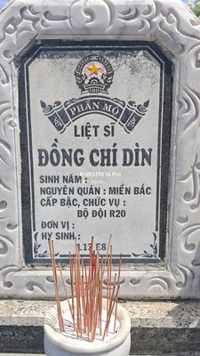 Ảnh bia mộ của liệt sĩ Đồng chí Dìn